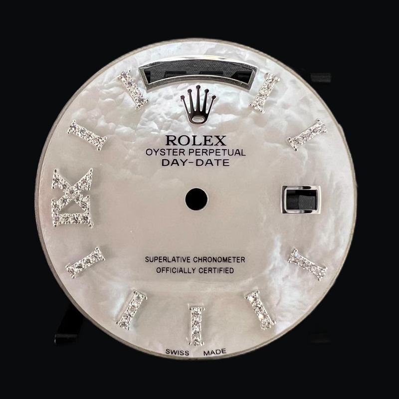 White mother-of-pearl Day-Date dial with diamond numerals
